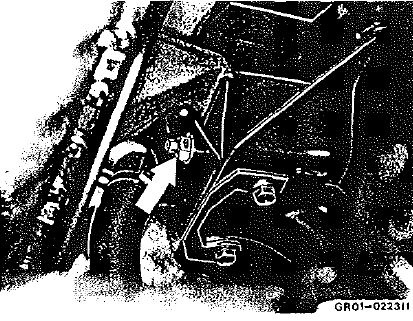 2 Desserrer i'écrou de la vis de butée du bloc de